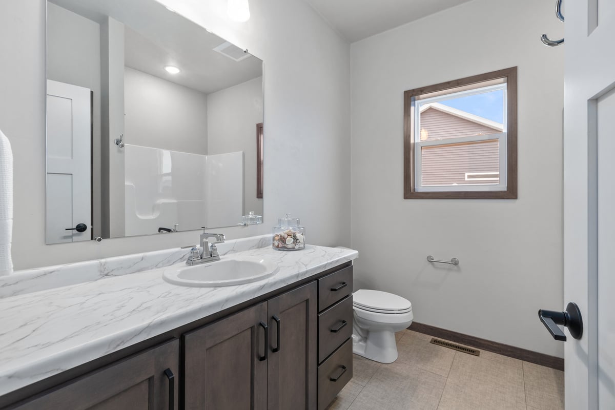 Clean and bright bathroom in Neenah, WI custom home by Midwest Design Homes