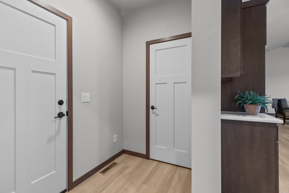 Hallway with dual doors in De Pere WI custom home by Midwest Design Homes