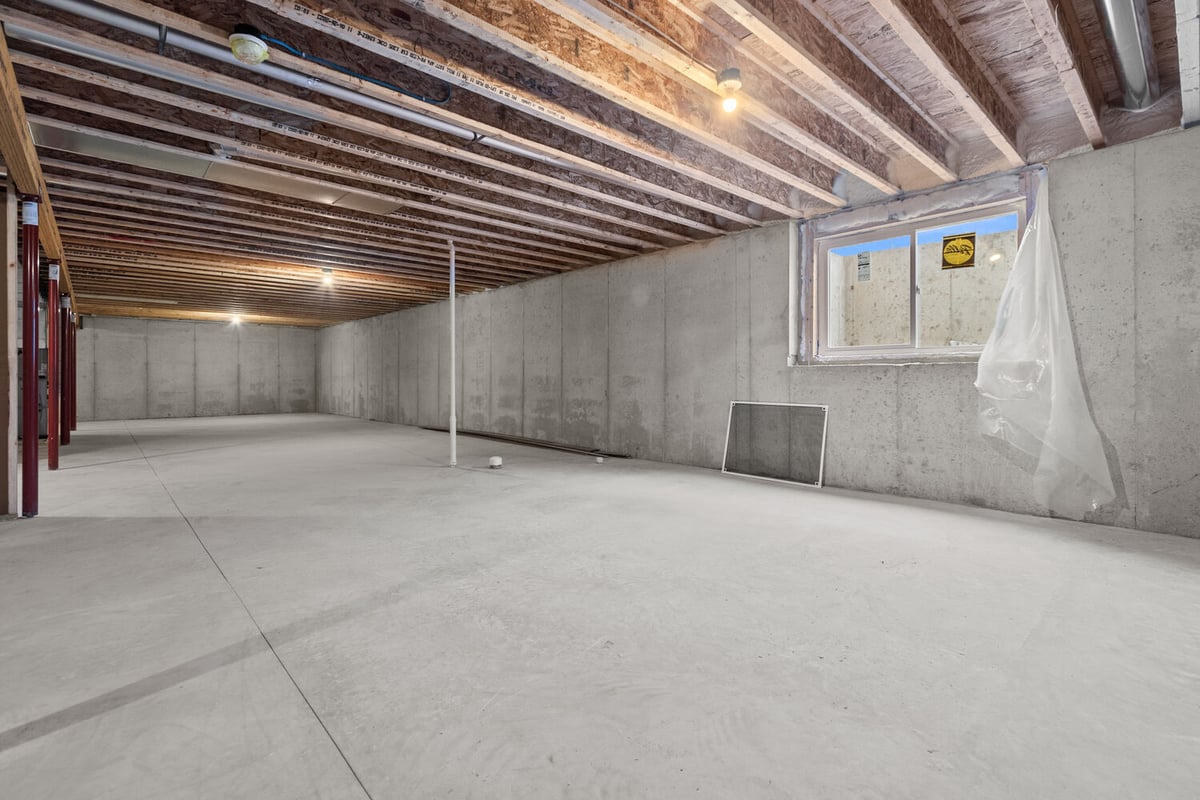 Spacious unfinished basement in Harrison, WI home by Midwest Design Homes