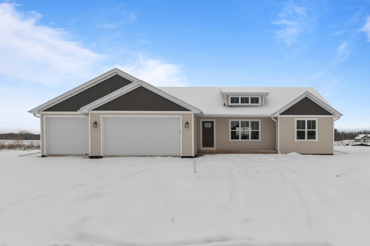 Custom home exterior in winter built by Midwest Design Homes in Kaukauna, WI and nearby areas