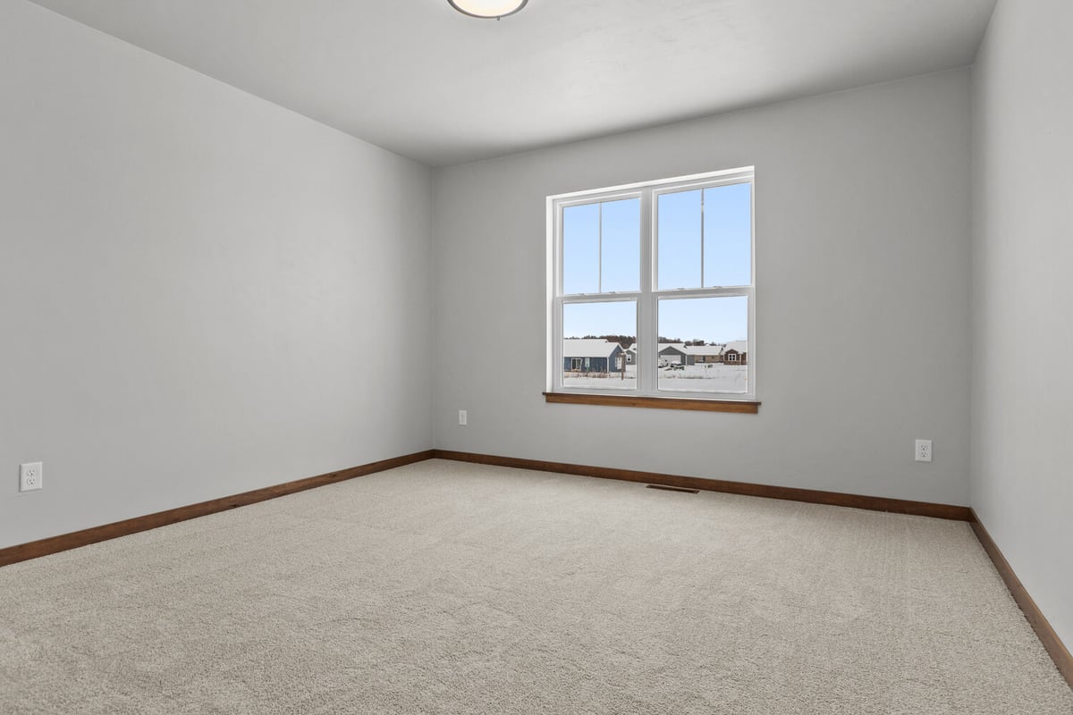 Midwest Design Homes custom home bedroom with large window in Kaukauna, WI