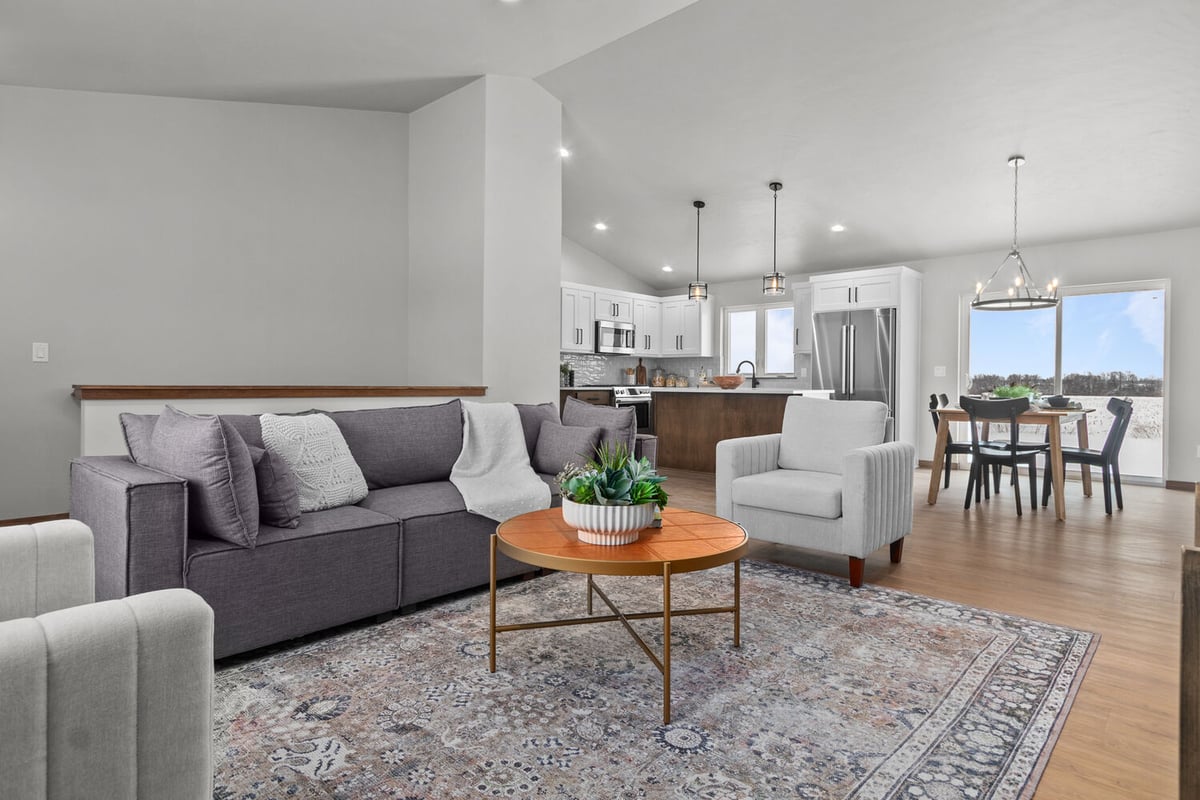 Open-concept living room and kitchen in Midwest Design Homes custom home in Kaukauna, WI
