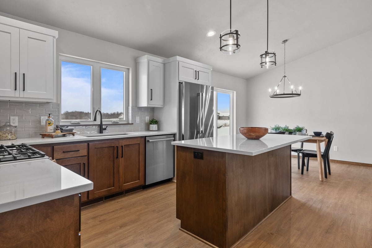 Stainless kitchen appliances and island in custom home by Midwest Design Homes in Kaukauna, WI