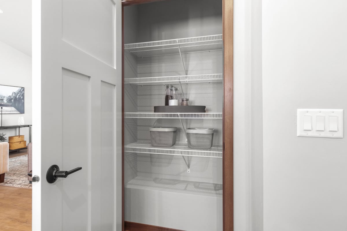 White wire pantry shelves in Midwest Design Homes kitchen in Kaukauna, WI custom home
