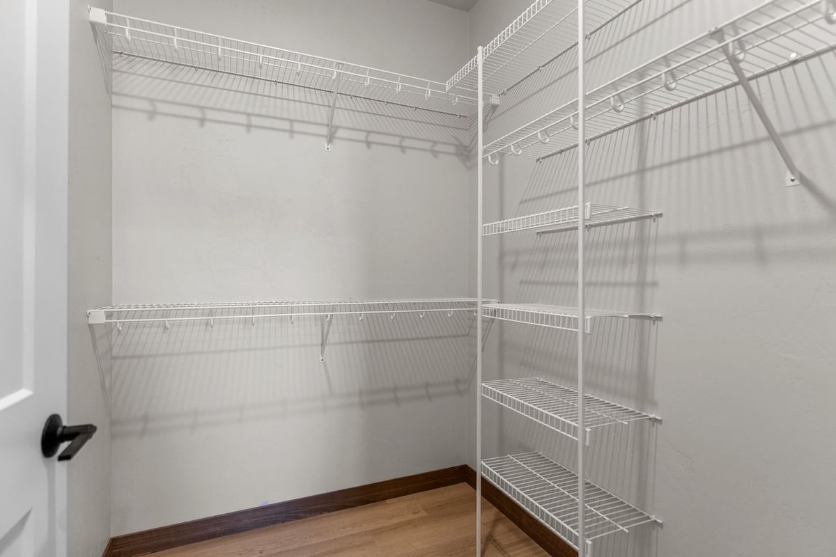 Wire shelving in walk-in closet of Midwest Design Homes custom home in Wisconsin