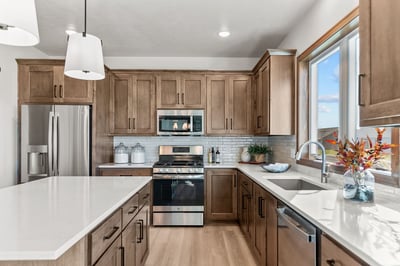 Wisconsin custom kitchen with quartz counters and wood cabinets by Midwest Design Homes