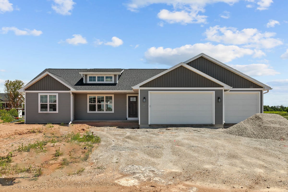 Custom home exterior by Midwest Design Homes in Kaukauna, WI nearing completion