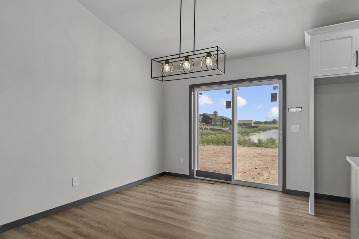Custom-built dining room with outdoor view in Wisconsin by Midwest Design Homes
