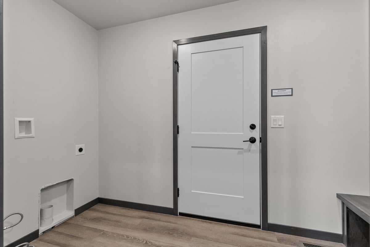 Entry to mudroom laundry combo in Kaukauna home by Midwest Design Homes