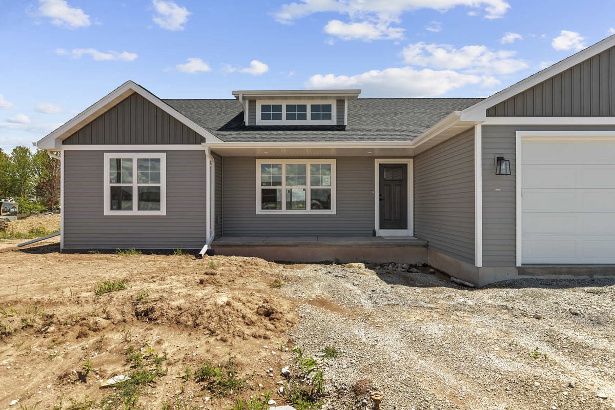Front porch and entry door detail of custom home in Kaukauna, WI by Midwest Design Homes