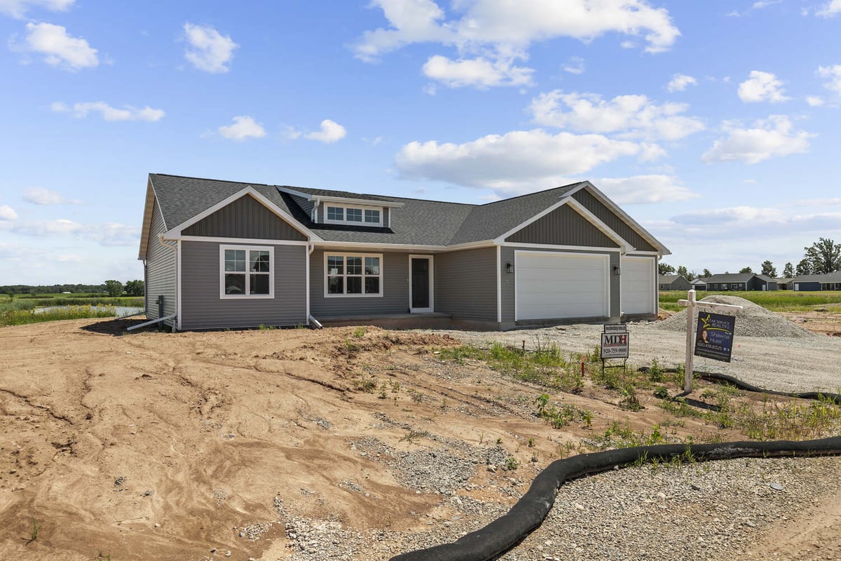 Midwest Design Homes new construction with signage in Wisconsin development