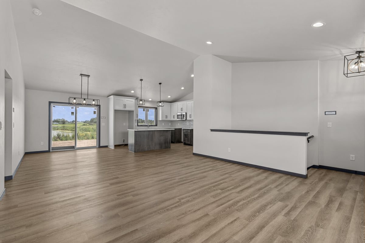 Open layout between kitchen and living in WI custom home by Midwest Design Homes