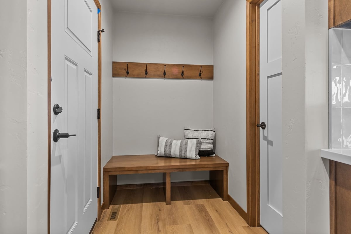 Custom mudroom entry with wood bench by Midwest Design Homes in Fox Cities, Wisconsin
