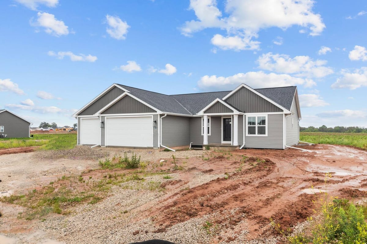 Front view of custom gray home by Midwest Design Homes in De Pere and Appleton, WI
