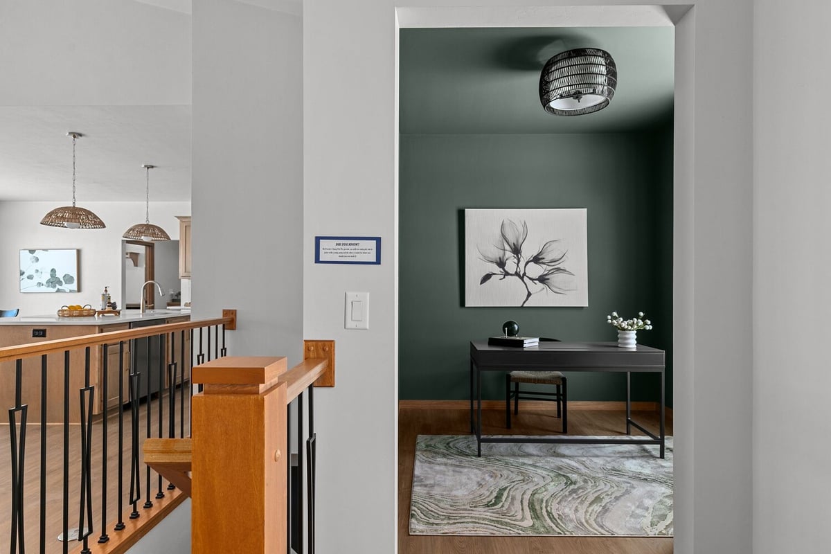 Stylish home office remodel by Midwest Design Homes in Appleton WI with green accent wall