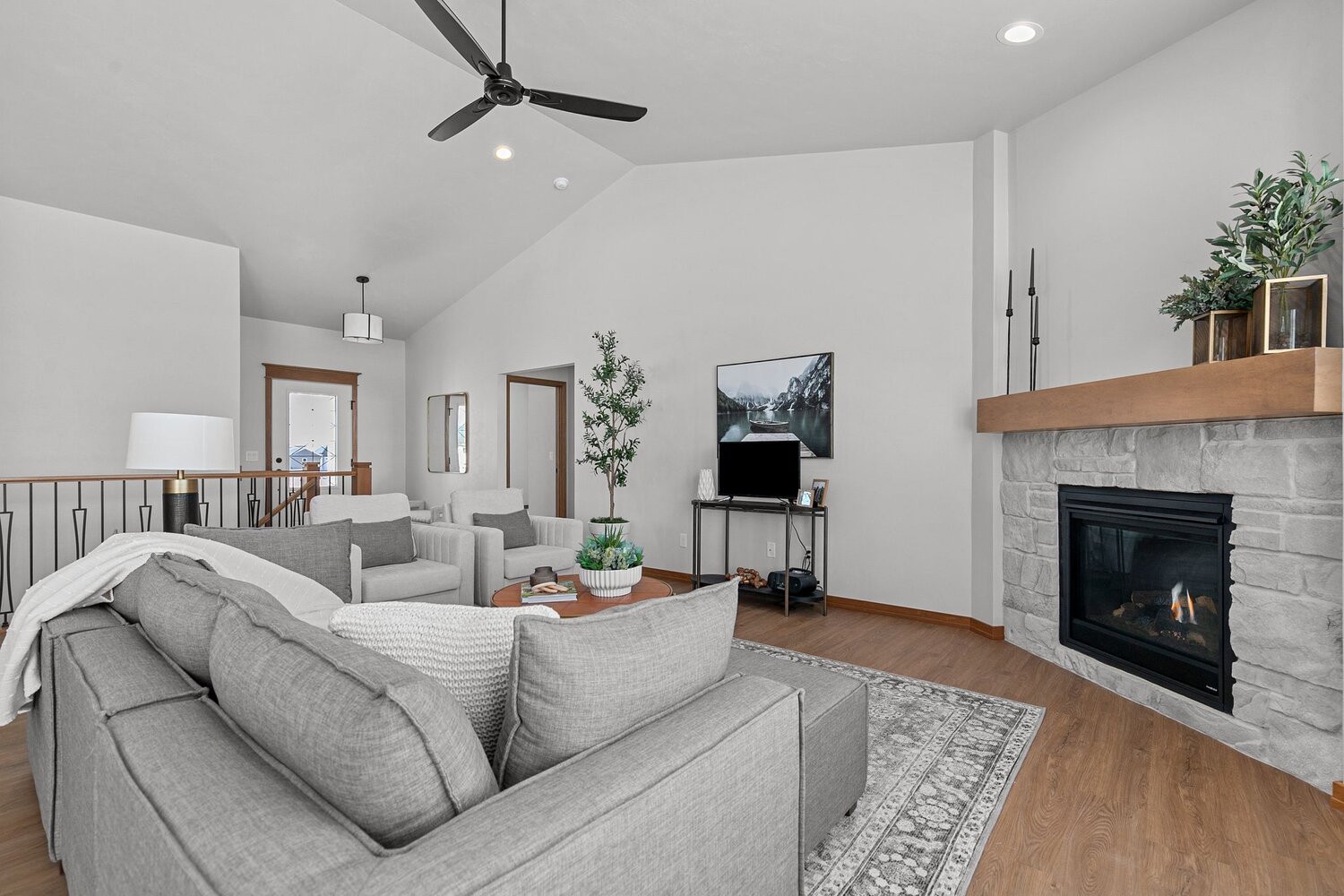 TV and fireplace in stylish living room by Midwest Design Homes in Kaukauna, WI