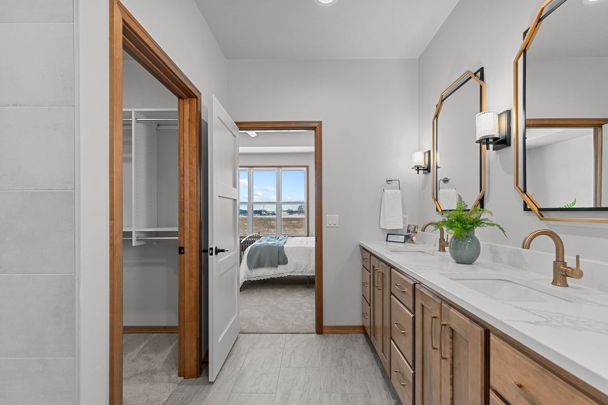 View of bathroom into bedroom in custom home by Midwest Design Homes in Greenville WI