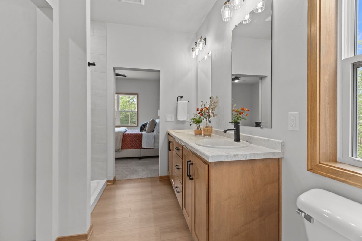 Modern bathroom with double sink by Midwest Design Homes in Appleton WI and Green Bay WI