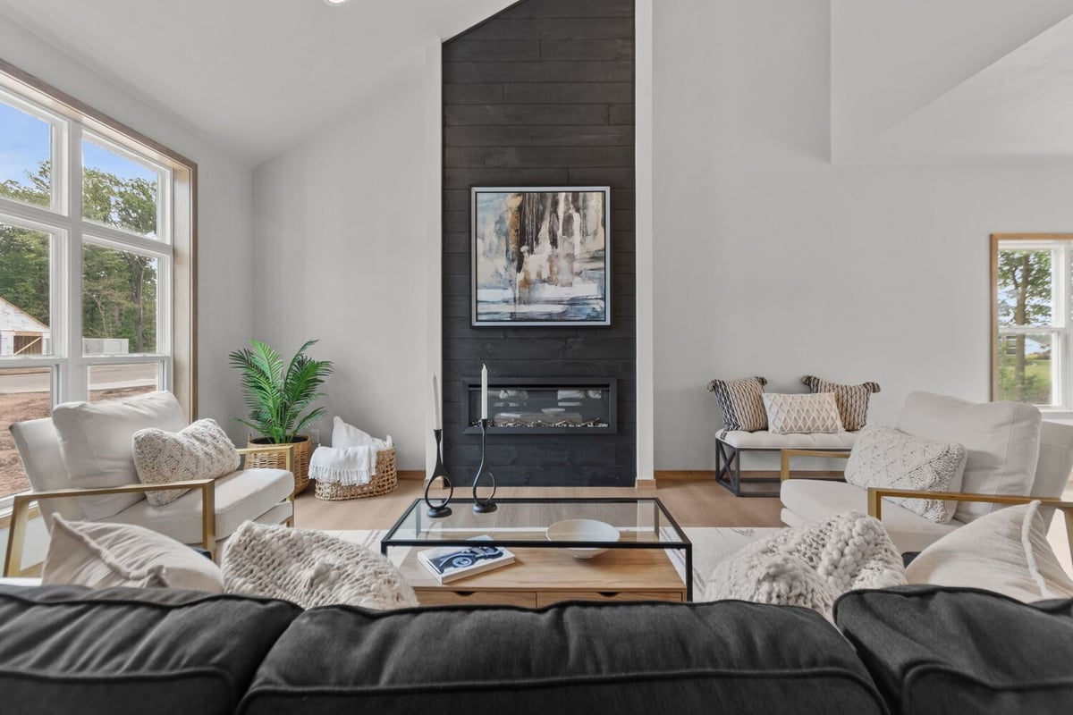 Modern living room with fireplace in custom home by Midwest Design Homes in Harrison, WI