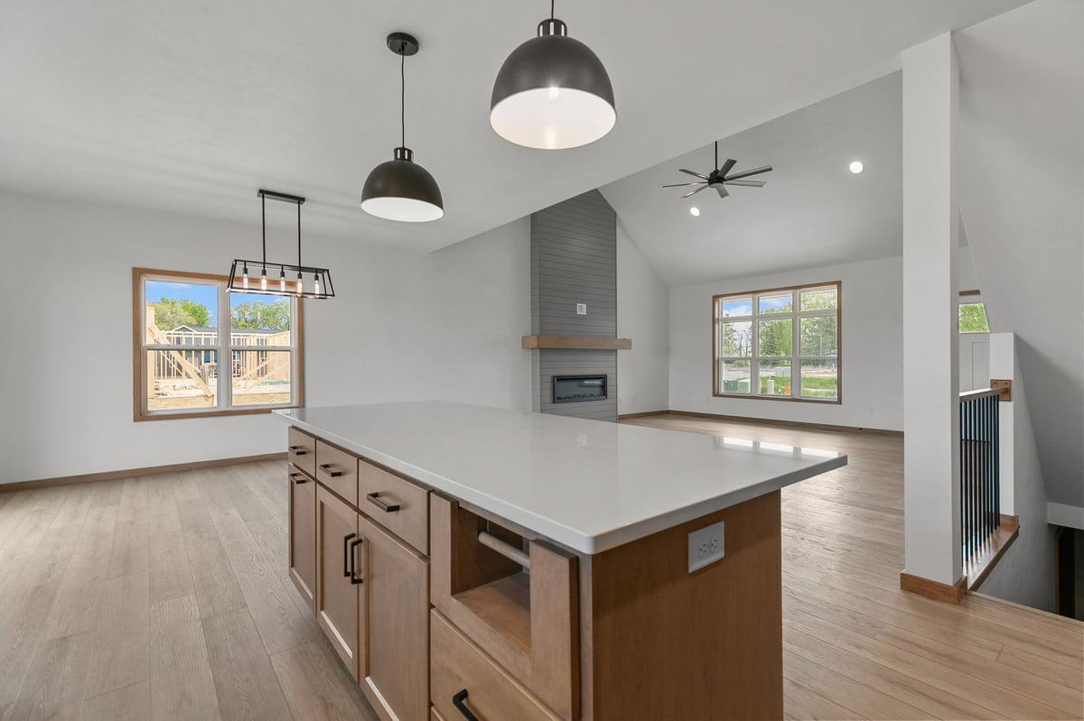 Open-concept kitchen and living area with fireplace in Appleton, WI