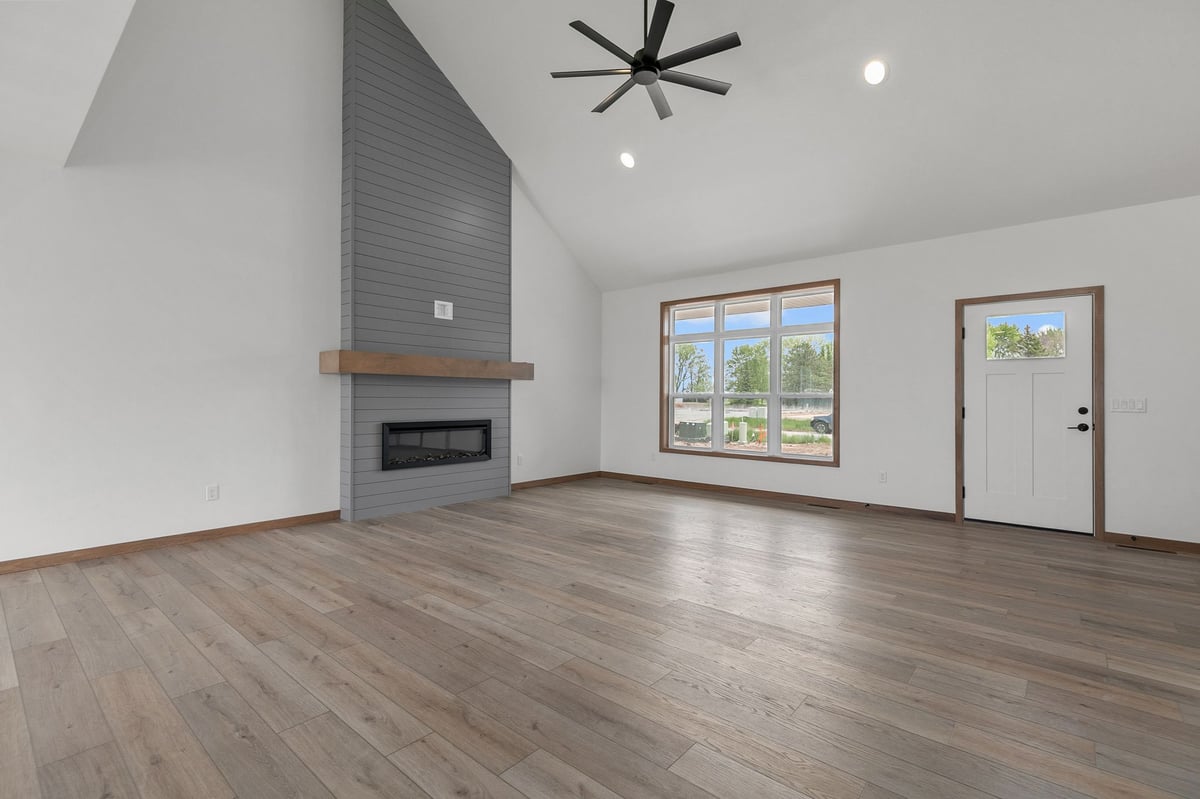 Spacious living room with vaulted ceiling and fireplace in Appleton, WI