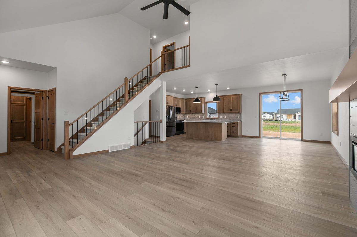 Spacious open living area with staircase and modern kitchen in Appleton, WI