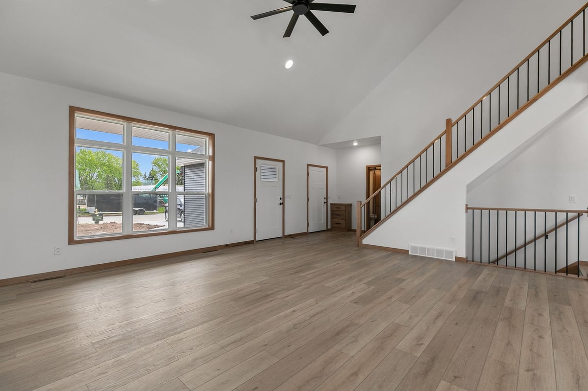 Spacious open-concept living area with vaulted ceiling in a modern Appleton, WI home