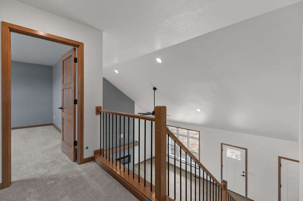 Upper hallway overlooking open-concept living space in Appleton, WI