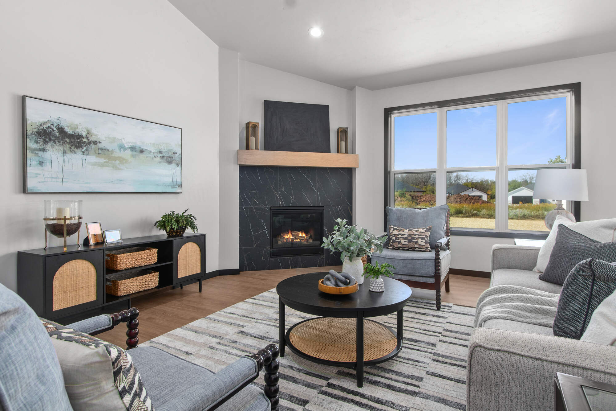 Stylish living room with natural wood tones by Midwest Design Homes in Appleton, WI