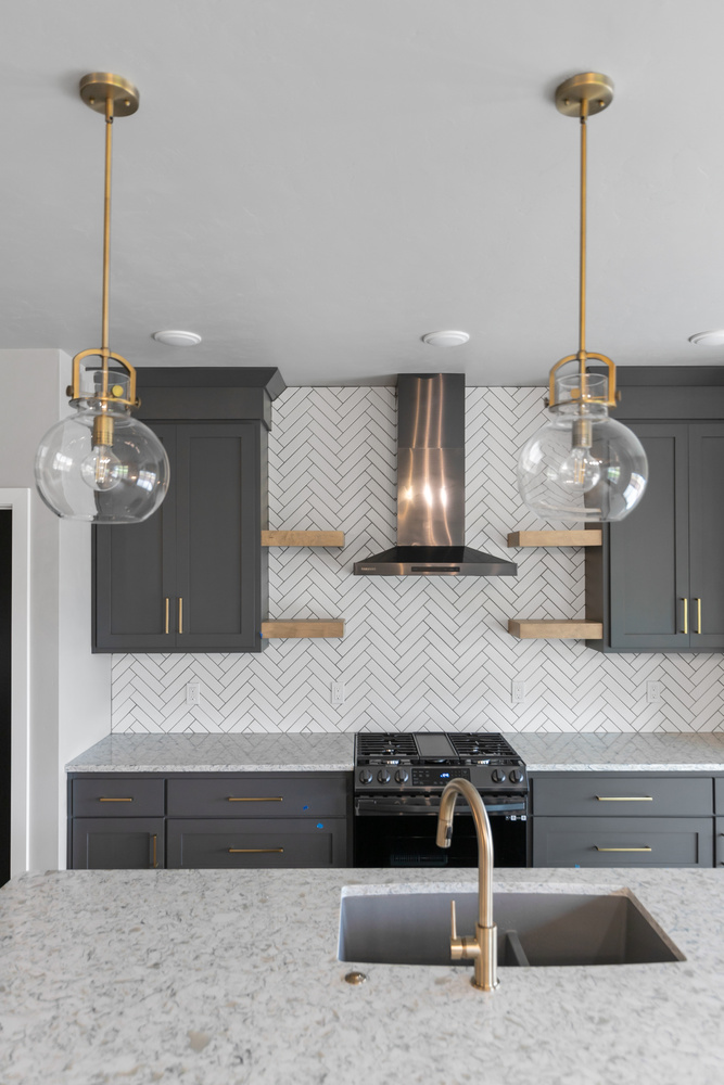 Kitchen island and pendant lights in custom home by Midwest Design Homes in Kaukauna WI