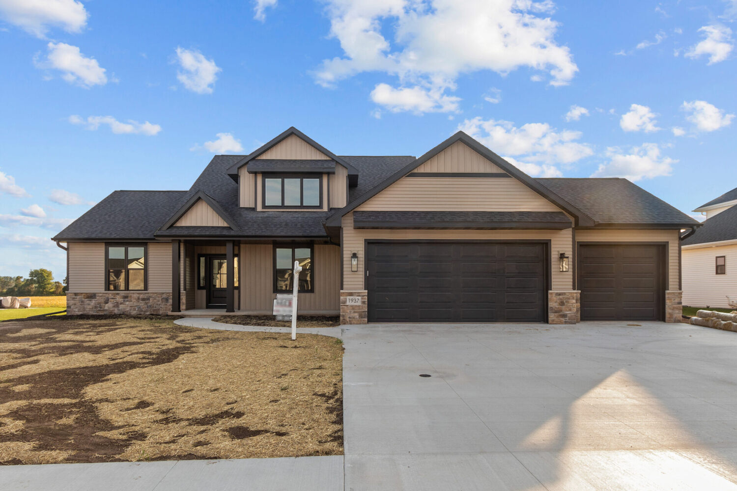 Modern beige and black exterior home built in Appleton, WI by Midwest Design Homes