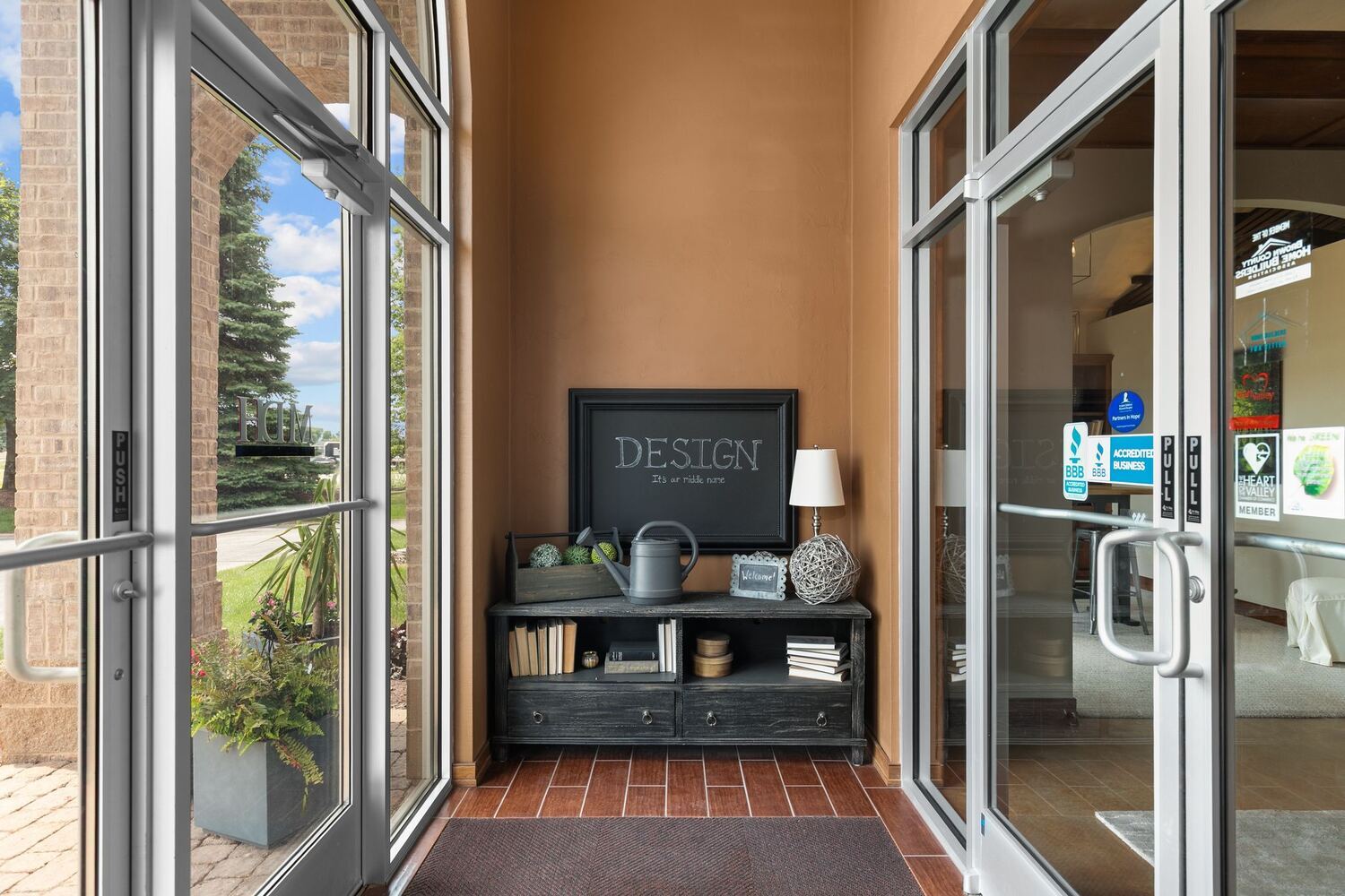 Design-focused entry nook at Midwest Design Homes Kaukauna office with decor accents