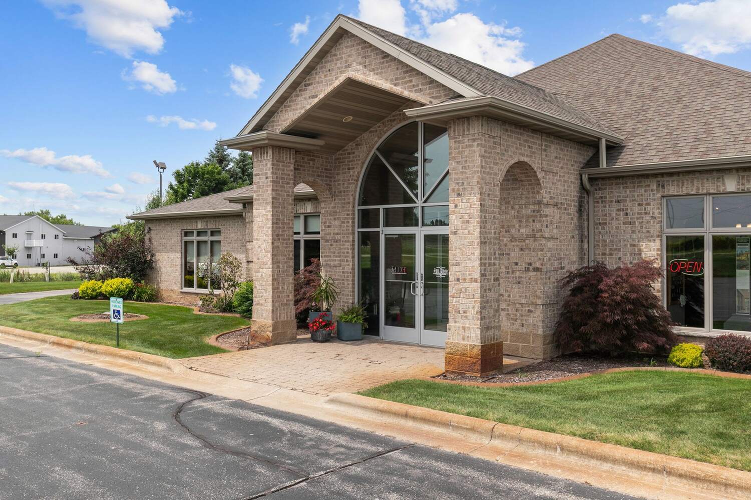 Full view of Midwest Design Homes brick office exterior in Kaukauna, Wisconsin