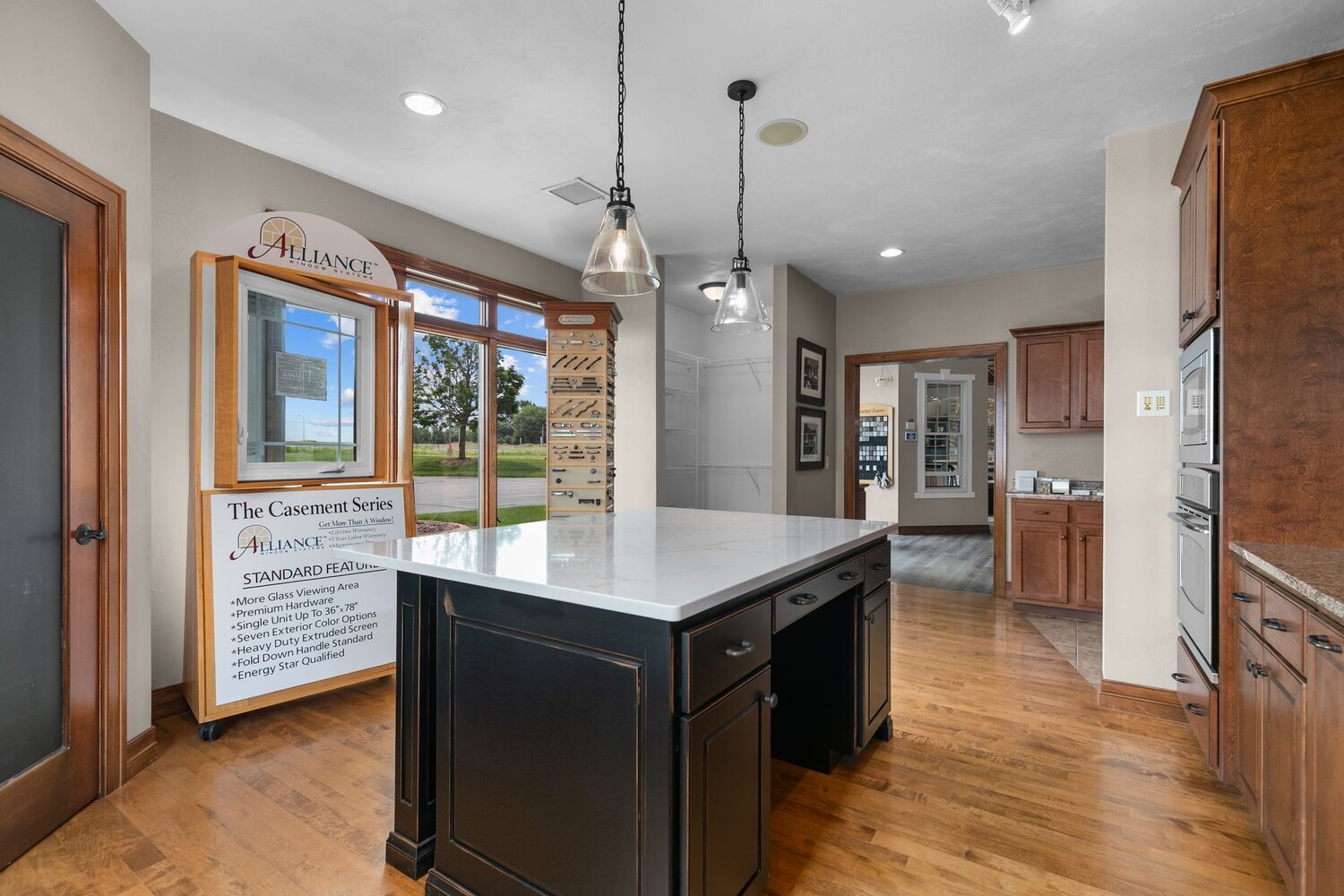 Kitchen design island with Alliance window display in Midwest Design Homes showroom WI