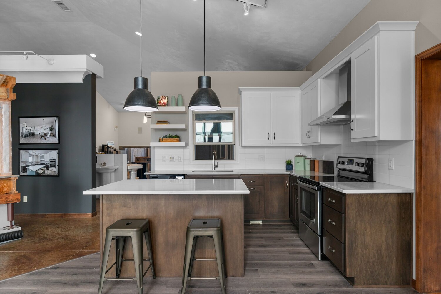 Kitchen showroom with white and brown cabinetry at Midwest Design Homes in WI