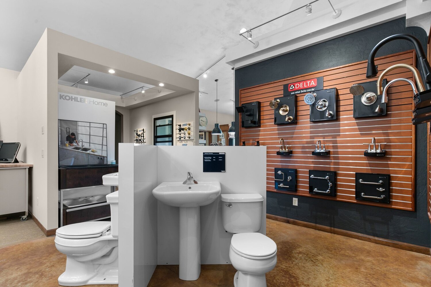 Plumbing fixture display in custom home showroom by Midwest Design Homes in Kaukauna, WI